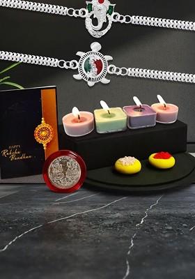 Raksha Bandhan Gift Set With Designer Rakhis Candles Roli Chawal Coin And Card