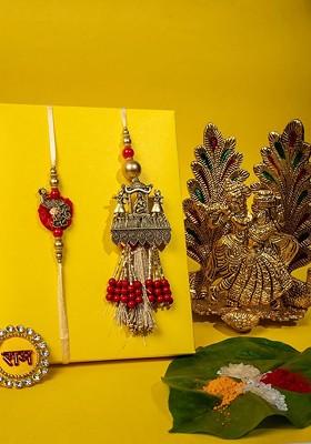 Set Of 2 Gold Plated Rakhis With Radha Krishna And Roli Chawal