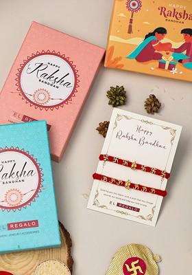 Set Of 2 Ganesha Om And Sathi Thread Rakhi With Roli Chawal And Greeting Card