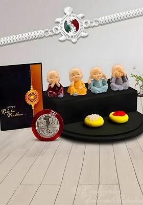 Silver Plated Rakhi With Baby Buddha Silver Coin And Greeting Card For Brother