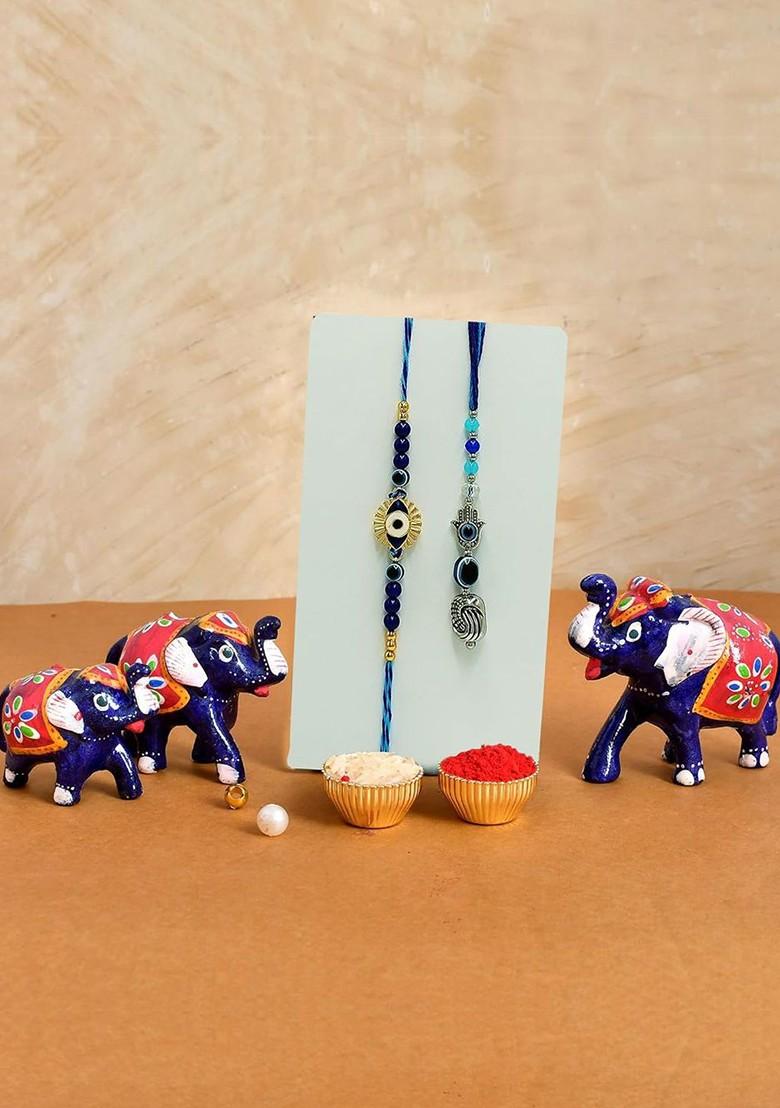 7 Pcs Rakhi With Showpiece And Tilak With Greetingcard