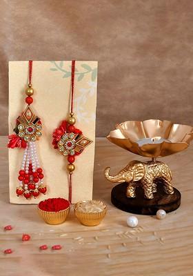 Set Of 3 Rakhis With Elephant Candle Holder With Roli Chawal