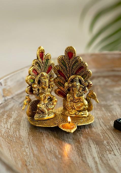 Gold Toned Laxmi Ganesh And Peacock Idol And Diya Decorative Showpiece Figurine