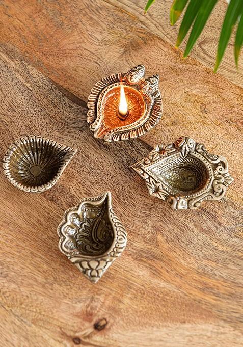 Yellow 4 Pieces Textured Laxmi Ganesh; Shankh Pushp Brass Diyas