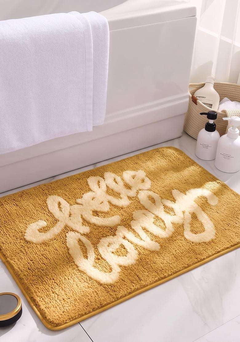 Saffron Rugs Hand Tufted Cotton Bath Mat | Mustard Yellow Rectangular | Anti Slip Backing | Casual Typography BATHMATS Bathroom Rug - Indya