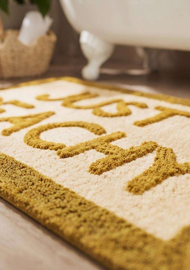 Saffron Rugs Hand Tufted Cotton Bath Mat | Mustard Yellow Rectangular | Anti Slip Backing | Casual Typography BATHMATS Bathroom Rug - Indya