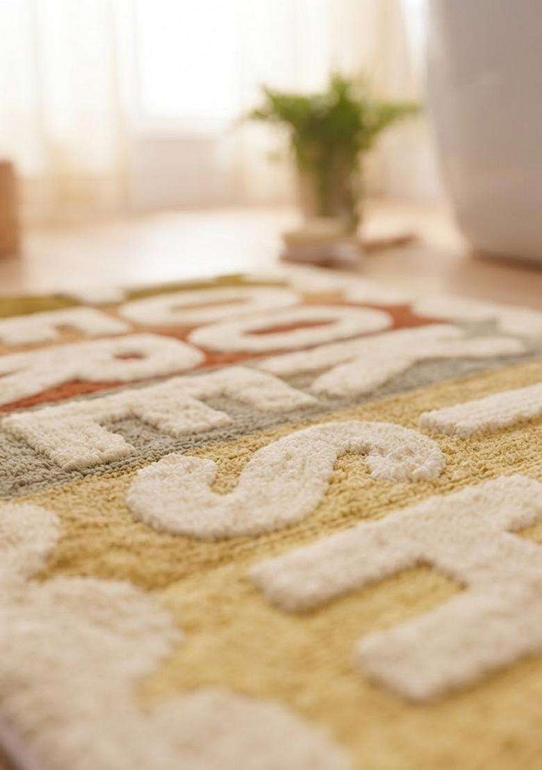 Saffron Rugs Hand Tufted Cotton Bath Mat | Multicolor Cream Rectangular | Anti Slip Backing | Retro Typography BATHMATS Bathroom Rug - Indya