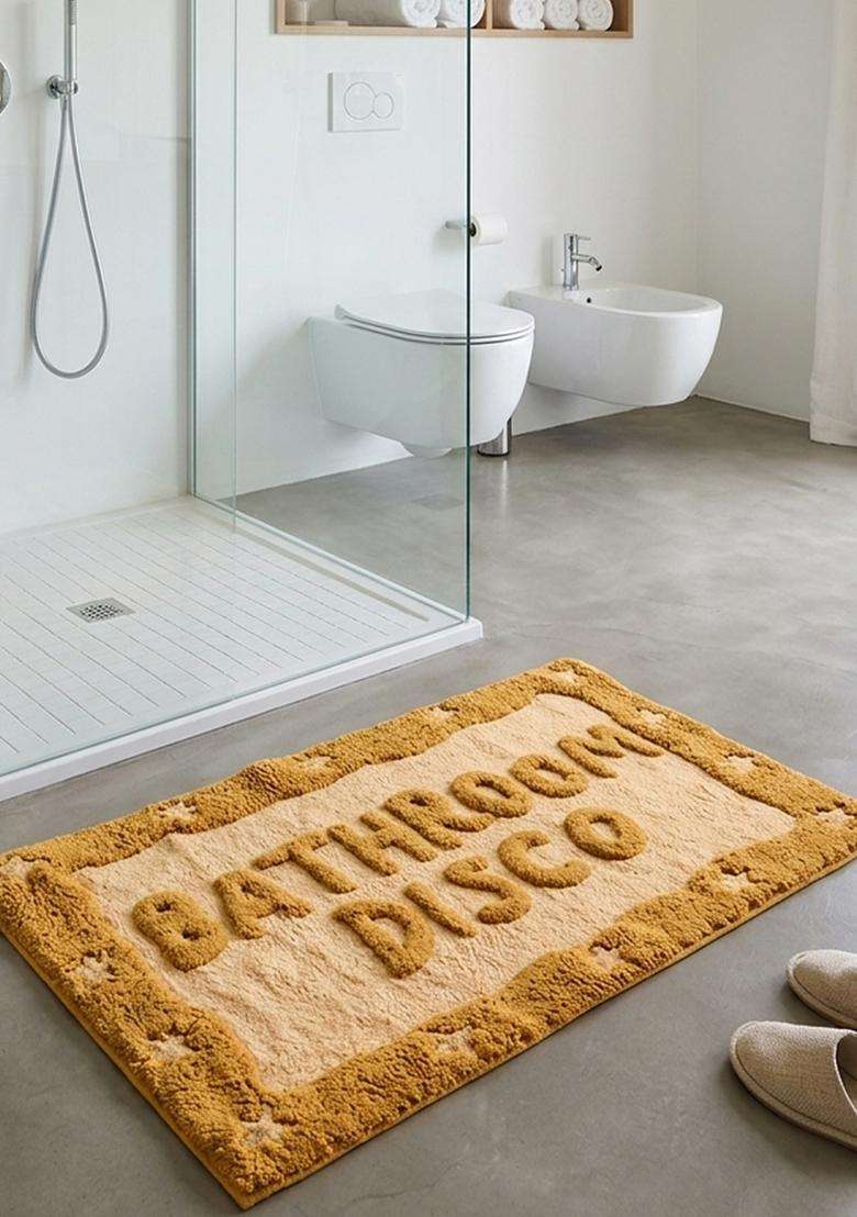 Saffron Rugs Hand Tufted Cotton Bath Mat | Mustard Yellow Rectangular | Anti Slip Backing | Retro Typography BATHMATS Bathroom Rug - Indya