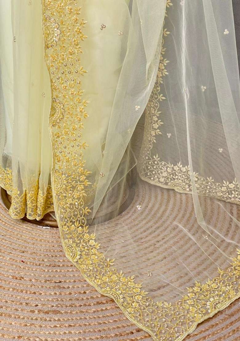 Pastal Yellow Net Bridal Designer Saree With Traditional Woven Design For Women - Indya