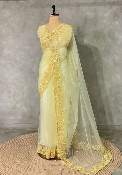 Pastal Yellow Net Bridal Designer Saree With Traditional Woven Design For Women