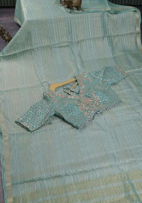 Tissue Silk Saree Pastel Green Shade With Allover Silver Gold Zari Weaves And Zari Woven Border With Traditional Woven Design For Women