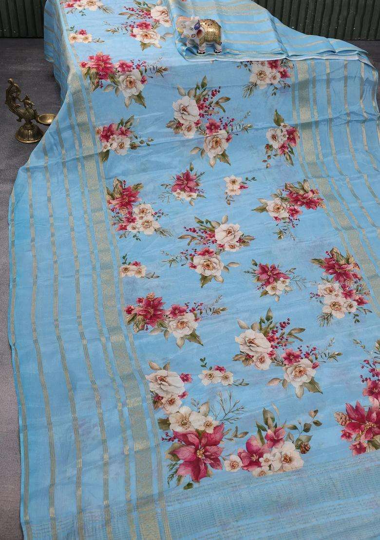 Semi Georgette Saree Blue Shade With Allover Floral Prints And Long Zari Woven Border With Printed Design For Women - Indya