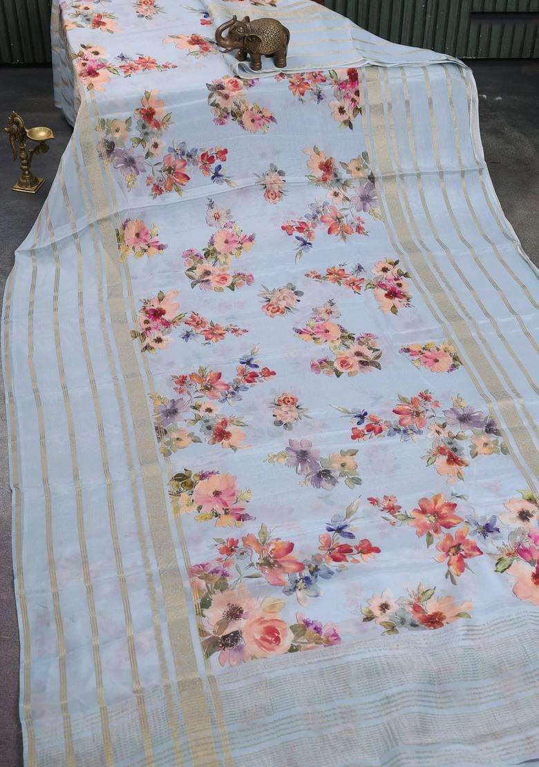 Semi Georgette Saree Pastel Blue With Allover Floral Prints And Long Zari Woven Border With Printed Design For Women - Indya