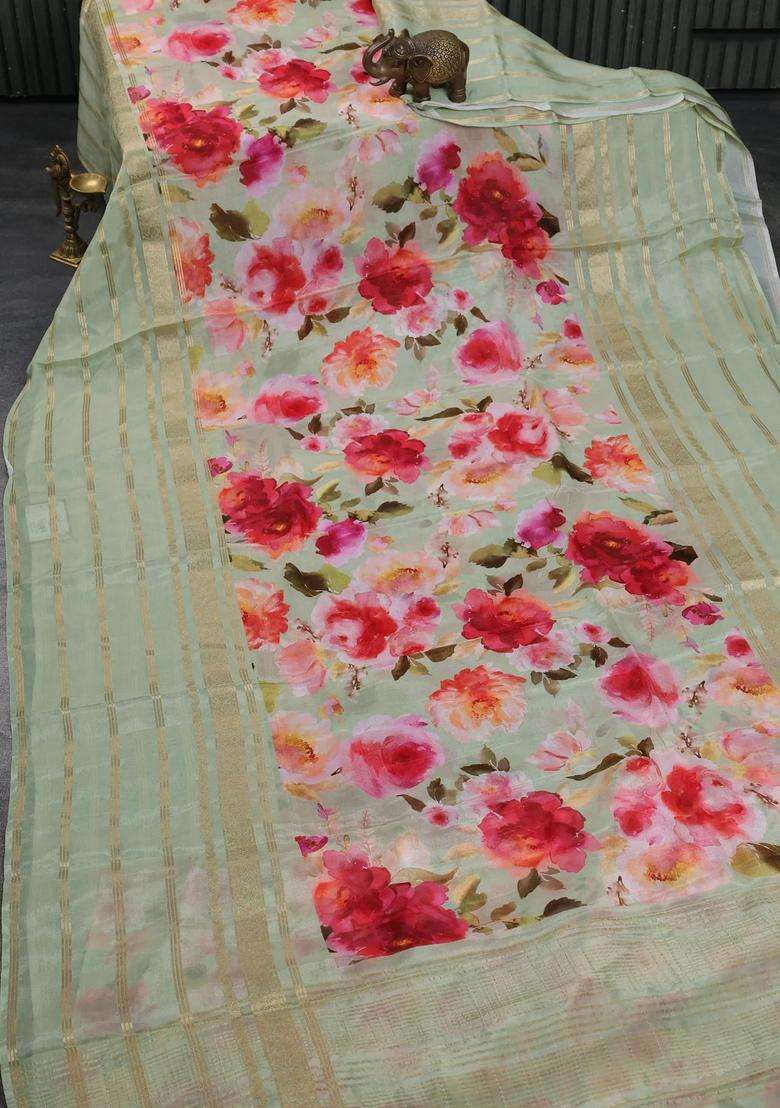 Semi Georgette Saree Pastel Green With Allover Floral Prints And Long Zari Woven Border With Printed Design For Women - Indya