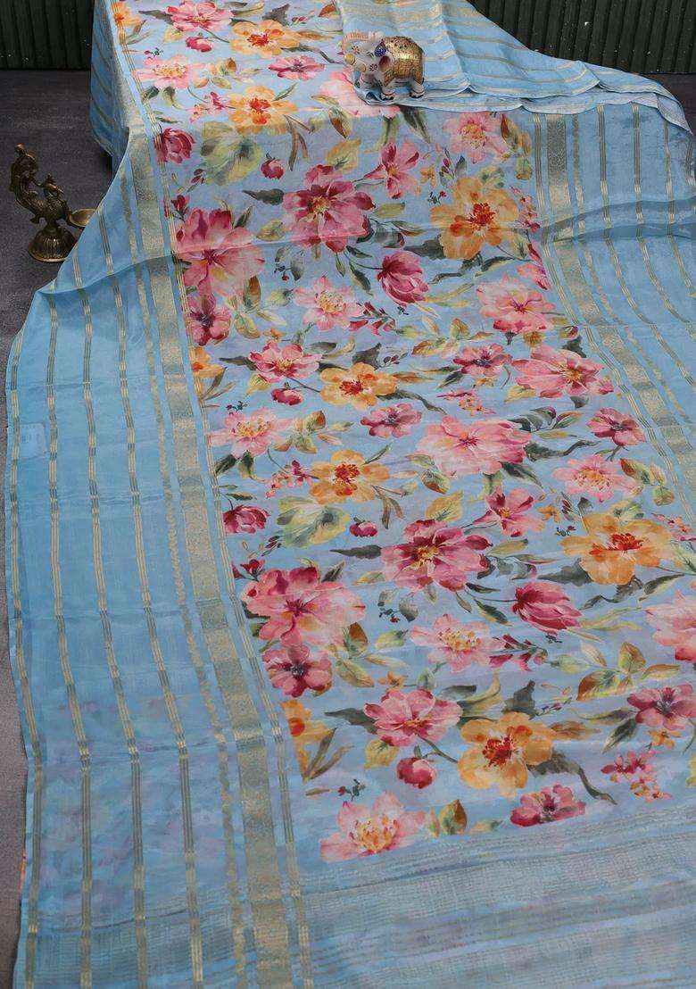 Semi Georgette Saree Pastel Blue With Allover Floral Prints And Long Zari Woven Border With Printed Design For Women - Indya