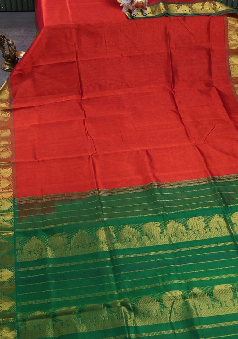 Silk Cotton Saree Rust Shade And Green With Plain Body And Paisley Temple Zari Woven Border With Korvai And Temple Border Design For Women - Indya