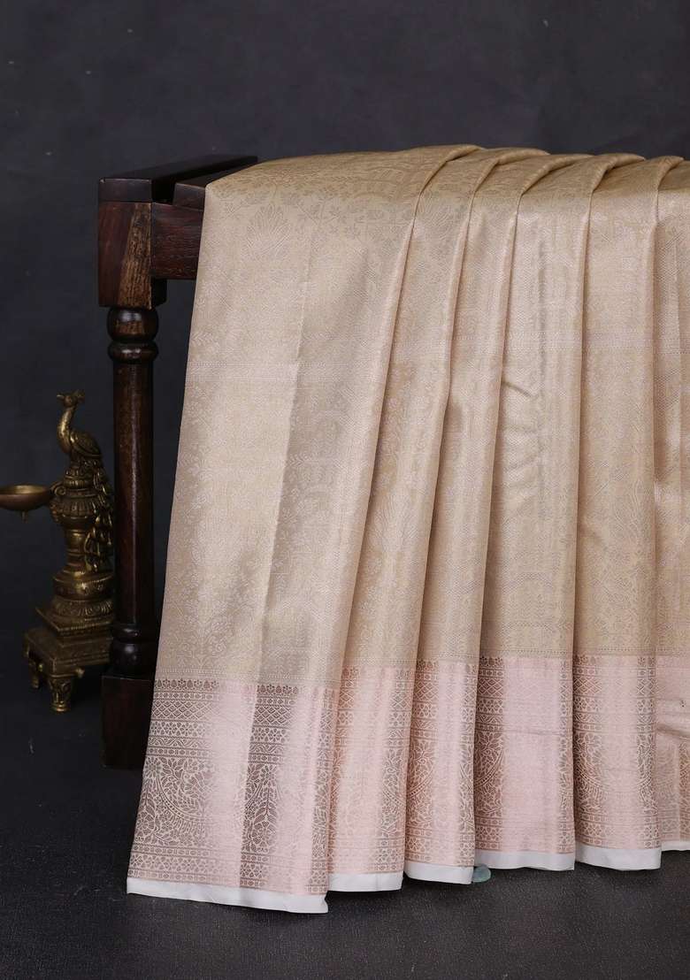Bangalori Tissue Silk Saree Cream With Allover Zari Woven Brocade Weaves And Long Zari Woven Border With Buttas And Brocade Design For Women - Indya