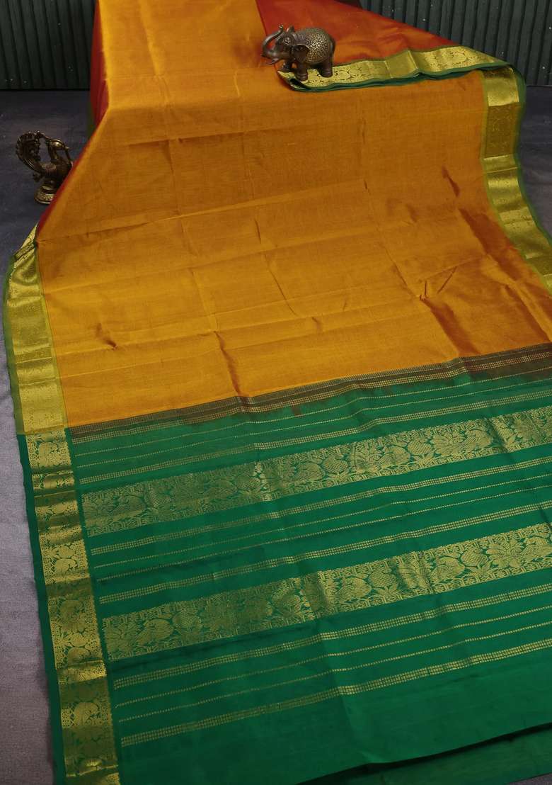 Silk Cotton Saree Dark Mustard And Green With Plain Body And Peacock Zari Woven Border With Traditional Woven Design For Women - Indya