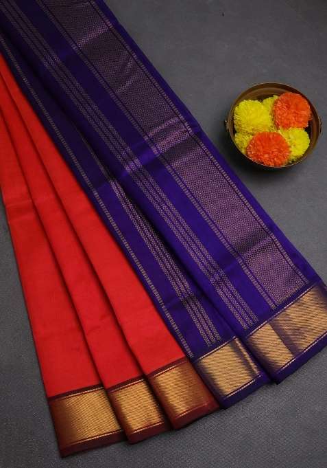 Silk Cotton Saree Dual Shade Of Pinkish Orange And Blue With Plain Body And Zari Woven Border With Traditional Woven Design For Women