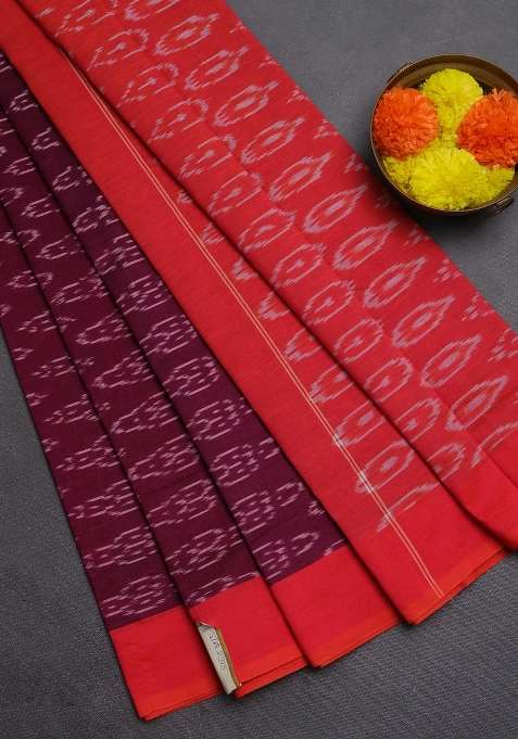 Ikat Cotton Saree Wine Shade And Red With Allover Ikat Weaves And Simple Border With Traditional Woven Design For Women