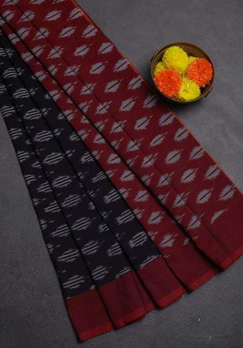 Ikat Cotton Saree Black And Maroon With Allover Ikat Woven Butta Weaves And Simple Border With Buttas And Brocade Design For Women