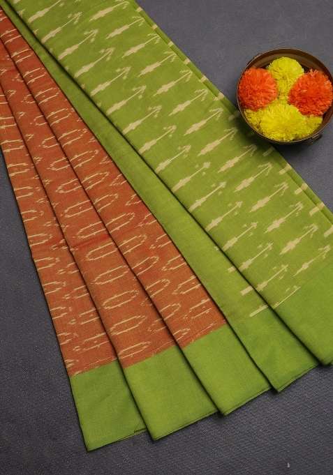 Ikat Cotton Saree Sunset Orange And Light Green With Allover Ikat Woven Butta Weaves And Simple Border With Buttas And Brocade Design For Women
