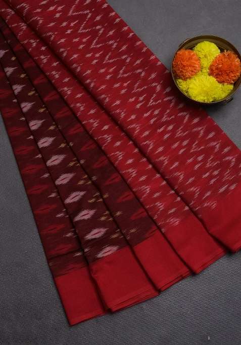 Ikat Cotton Saree Deep Maroon And Red With Allover Ikat Weaves And Simple Border With Traditional Woven Design For Women