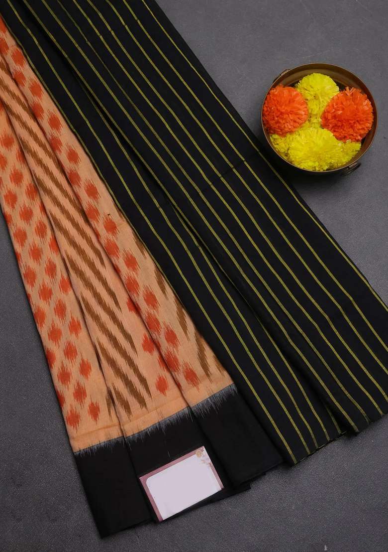 Ikat Cotton Saree Peach Shade And Black With Allover Ikat Weaves And Simple Border With Traditional Woven Design For Women - Indya