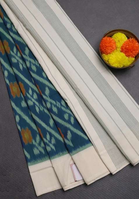 Ikat Cotton Saree Peacock Blue And Off White With Allover Ikat Weaves And Simple Border With Traditional Woven Design For Women
