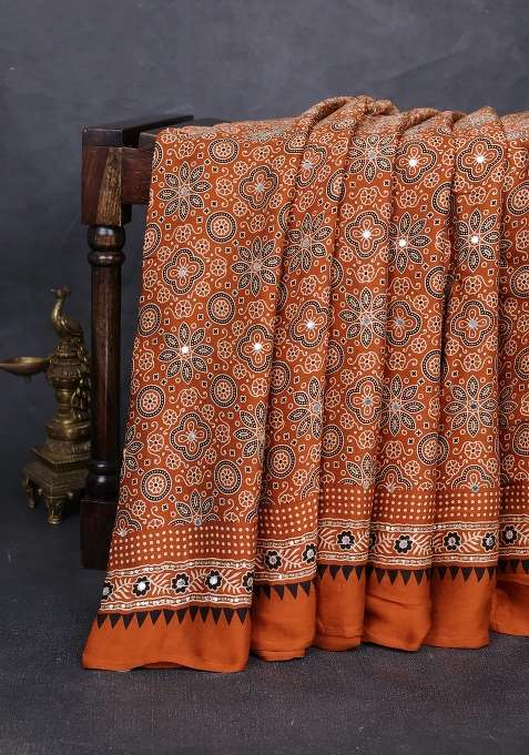 Modal Silk Saree Dark Mustard With Allover Ajrakh Prints And Mirror Sequin Embroidery Pallu With Embroidered Design For Women