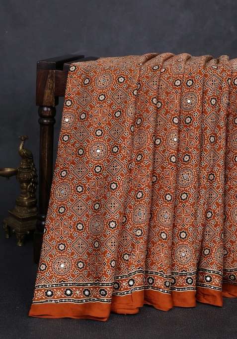 Modal Silk Saree Dark Mustard With Allover Ajrakh Prints And Mirror Sequin Embroidery Pallu With Embroidered Design For Women