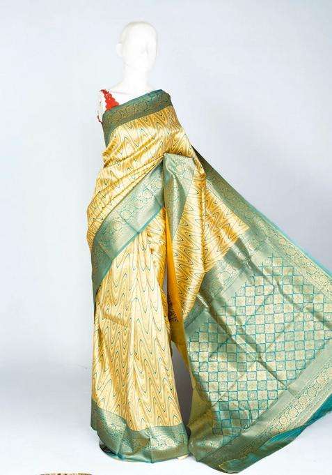 Gold Woven Blended Lichi Silk Saree With Waves Motifs With Buttas And Brocade Design For Women