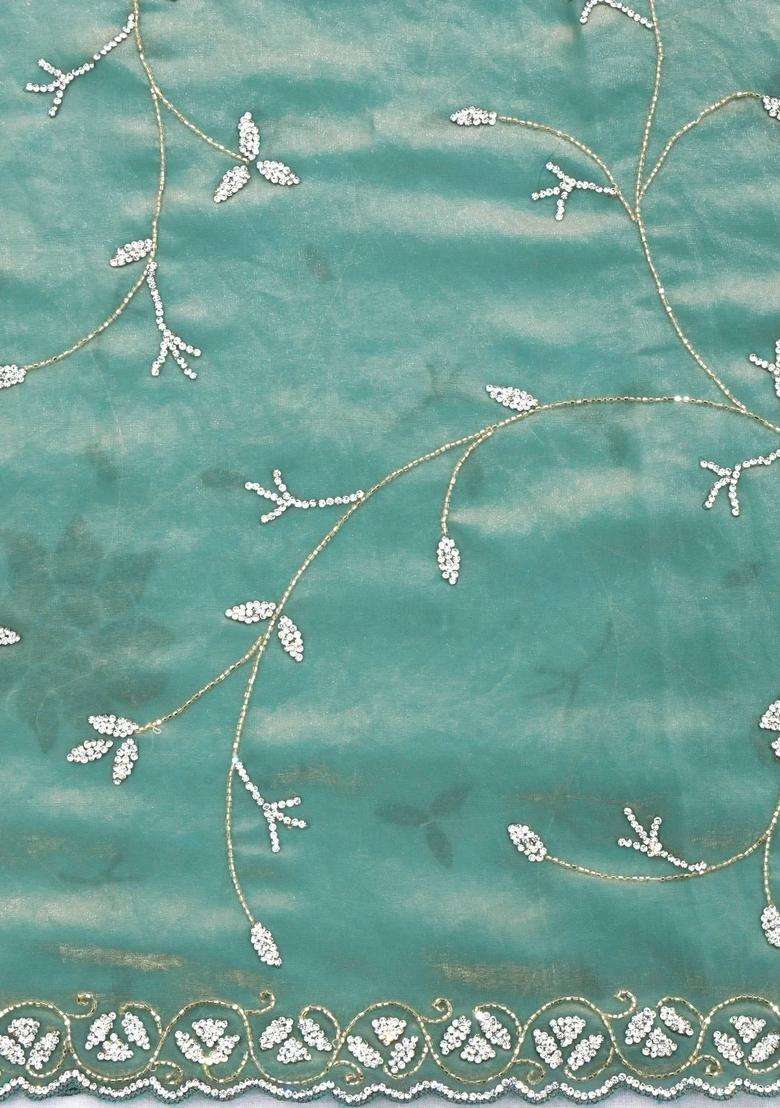 Turquoise Woven Blended Tissue Saree With Embroidered Floral Motifs For Women - Indya