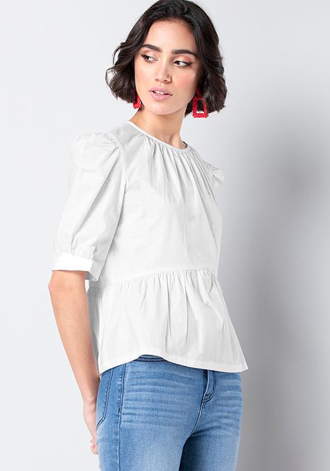 white puffed long sleeve top