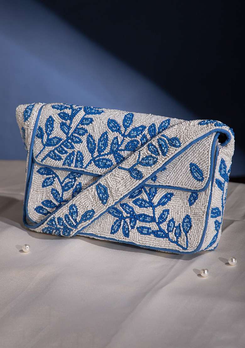 Ivory With Royal Blue Leafy Vine Motif Beaded Cotton Clutch - Indya