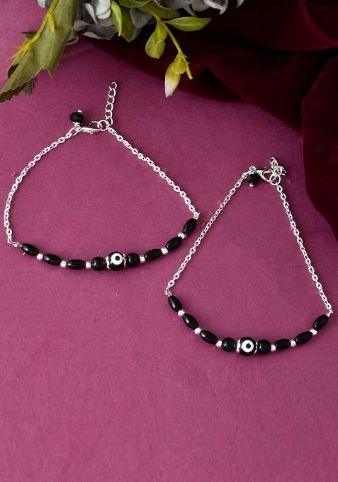 Set Of 2 Silver And Plated Stainless Steel Beaded Anklets With Artificial Black Stones And Floral Charms

