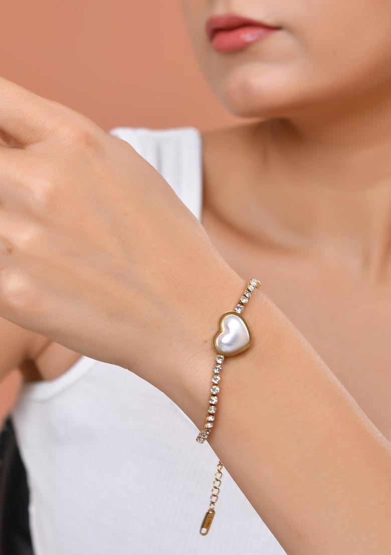 Gold Plated Ad Stone Studded With Heart Shaped Pearl Bracelet For Women - Indya