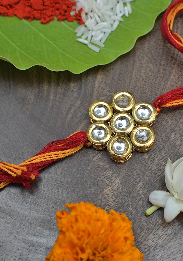 Kundan Floral Gold Tone Kundan Rakhi With Red Yellow Cotton Thread