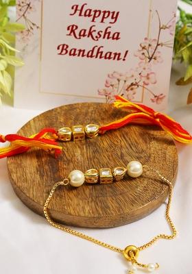 Set Of 2 Gold Toned Kundan Embellished Rakhi And Lumba Set 