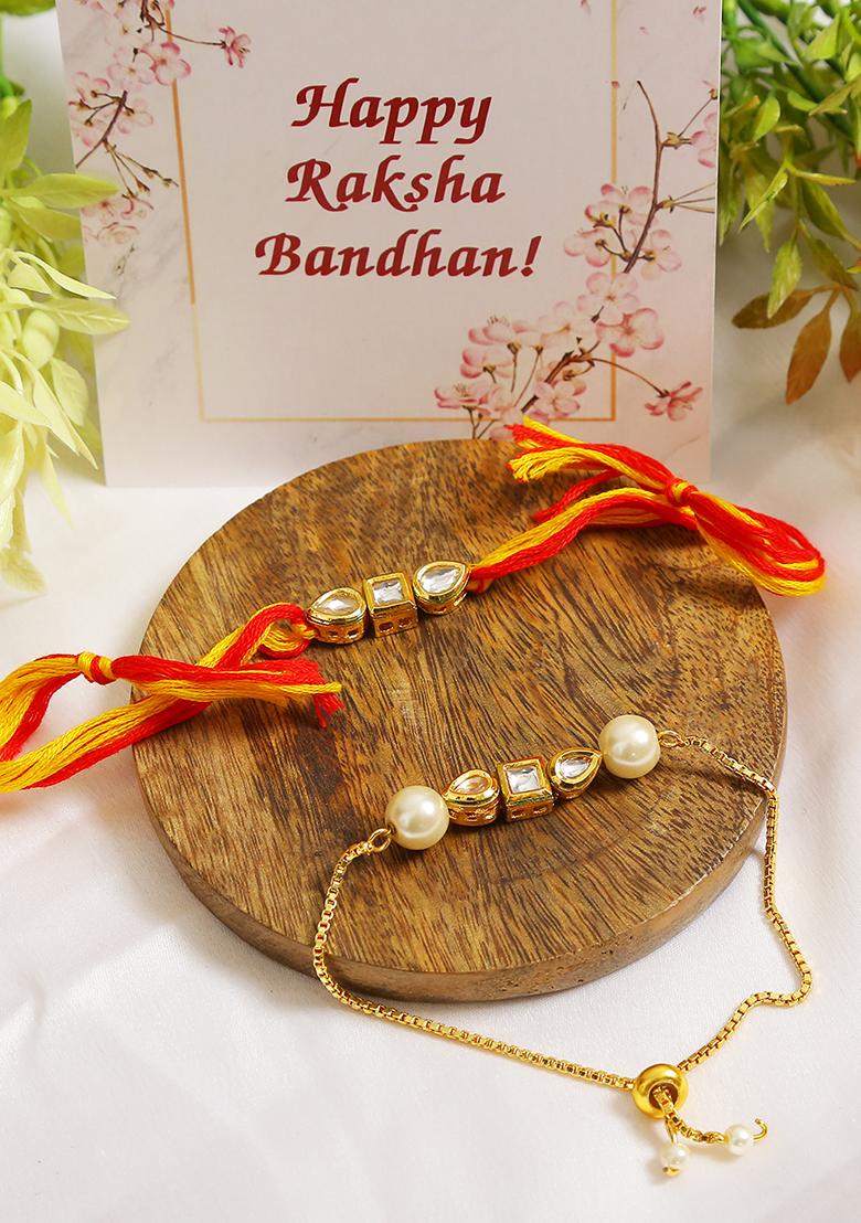 Set Of 2 Gold Toned Kundan Embellished Rakhi And Lumba Set 