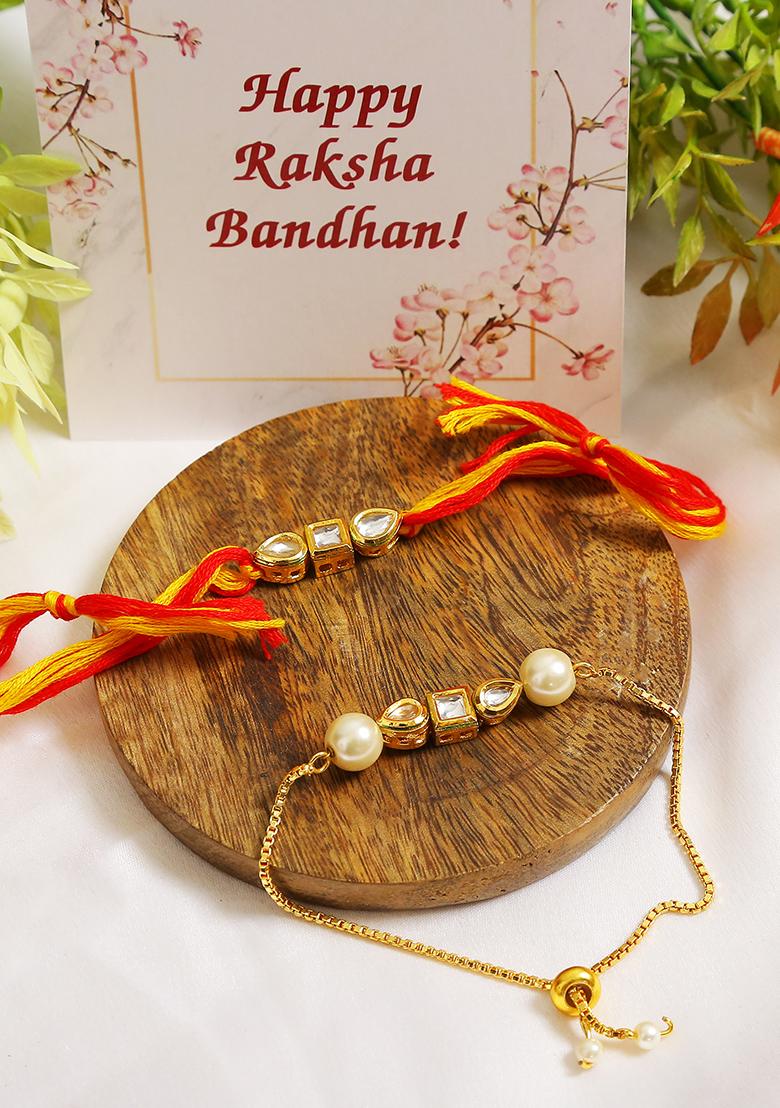 Set Of 2 Gold Toned Kundan Embellished Rakhi And Lumba Set 