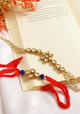 Set Of 2 Gold Toned Kundan Embellished Rakhi And Floral Lumba Set 