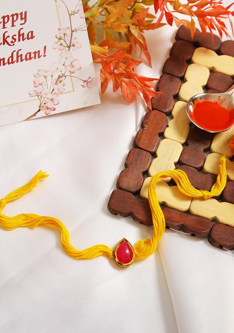 Red Gold Tone Kundan Rakhi With Yellow Thread