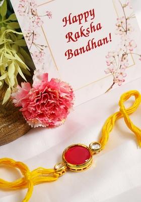 Red Gold Tone Kundan Rakhi With Yellow Thread