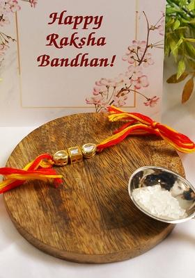 Gold Tone Kundan Rakhi With Red Yellow Cotton Thread