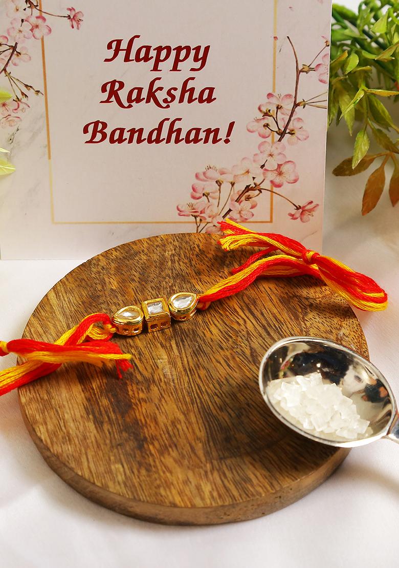 Gold Tone Kundan Rakhi With Red Yellow Cotton Thread