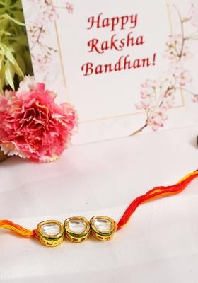 Gold Tone Kundan Rakhi With Red Yellow Cotton Thread
