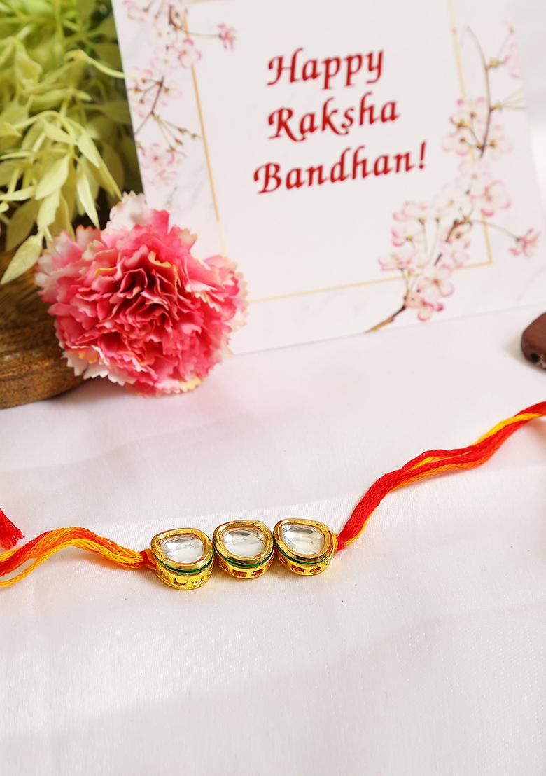 Gold Tone Kundan Rakhi With Red Yellow Cotton Thread
