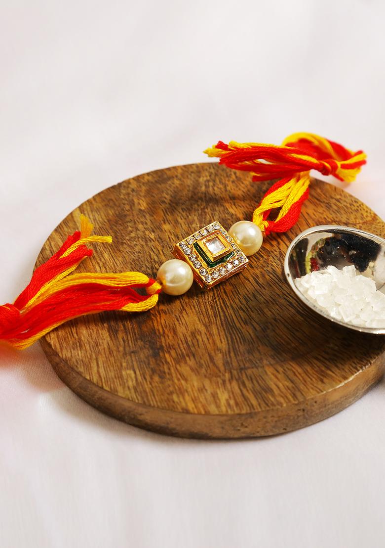 High Quality Kundan Studded Rakhi With Yellow Cotton Thread