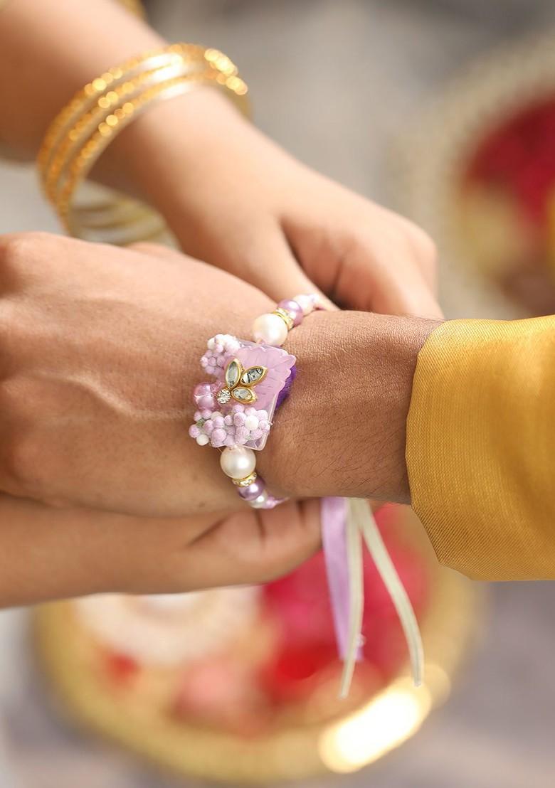 Floral And Lace Work Bhaiya Bhabhi Rakhi With Roli And Chawal